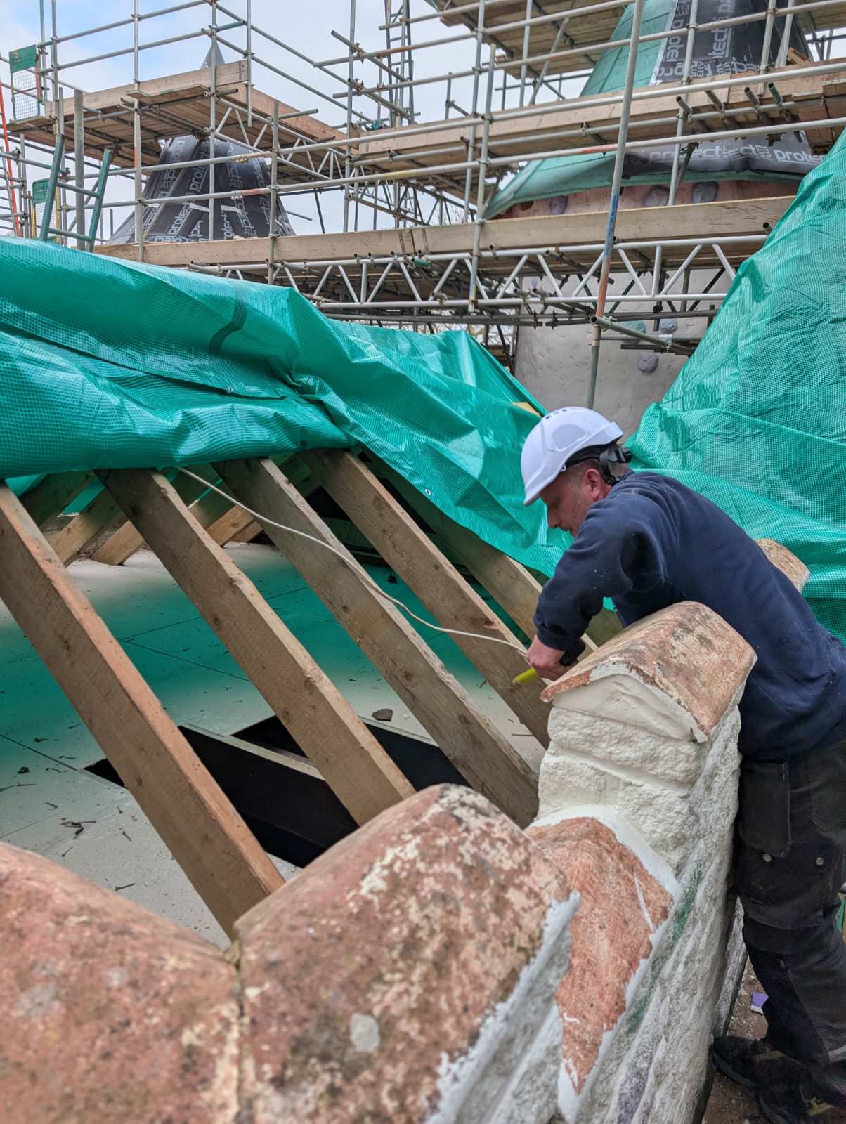 reaching inside during the Refurbishment of Lollipoppet Castle at Sundown Adventureland is underway